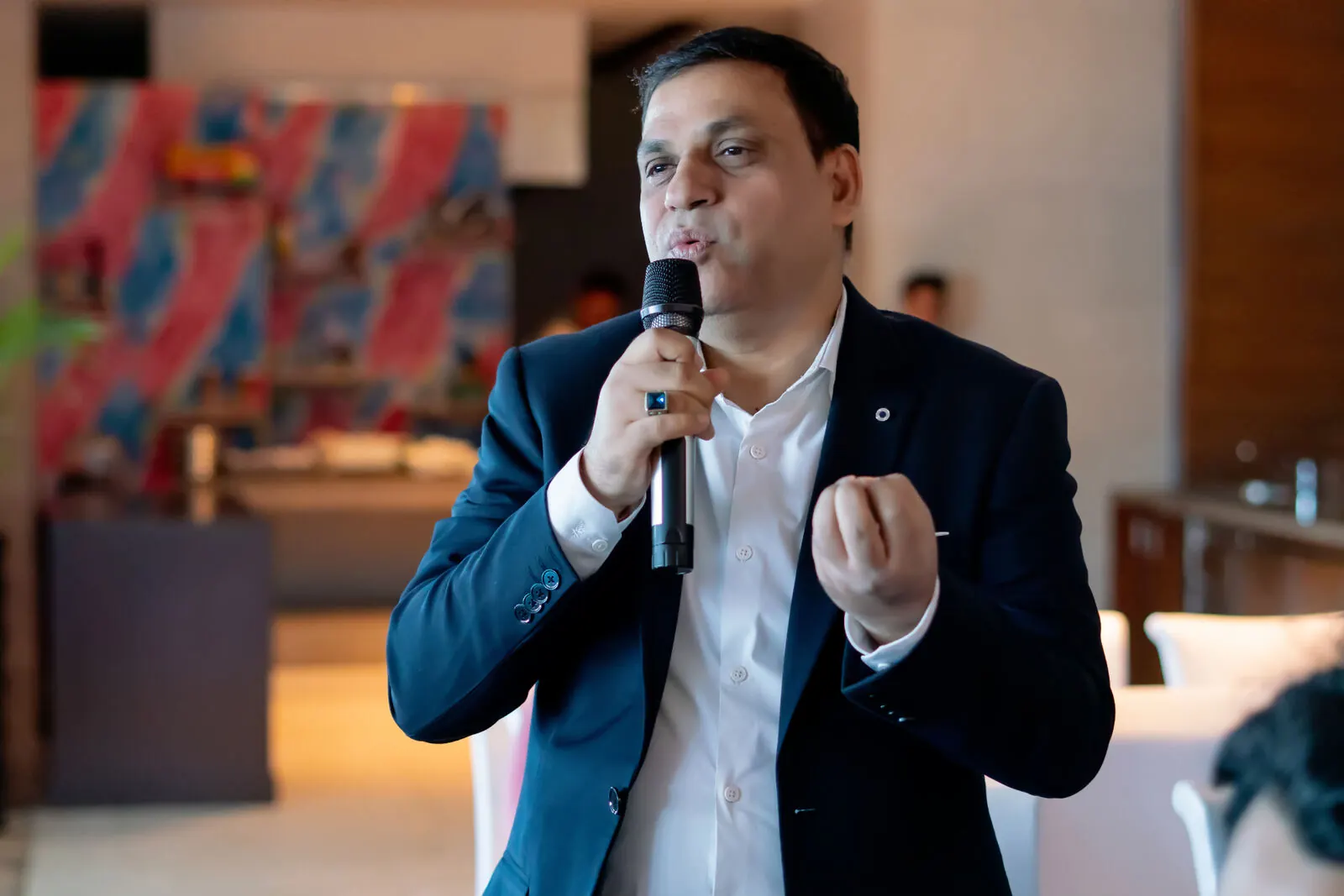 Abhishek Srivastava speaking with intent during a private session
